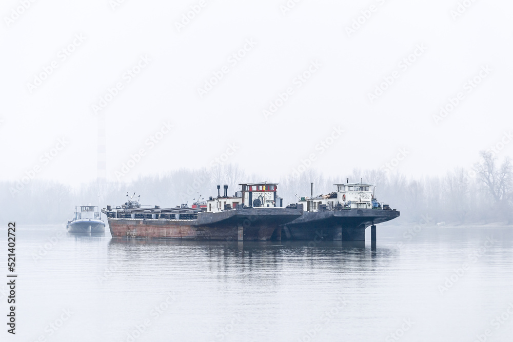 Anchored tankers during the winter period on the Danube River.