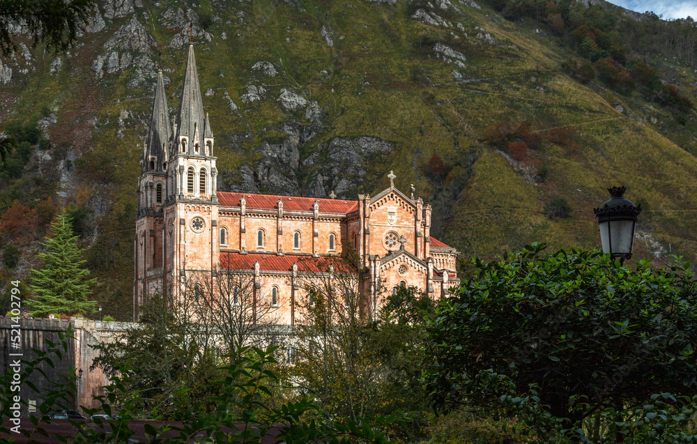 Basílica de Santa María la Real de Covadonga. Low point view of this great monumental temple built from 1877 to 1901, with a neo-Romanesque style and is made of pinkish marble stone extracted from the