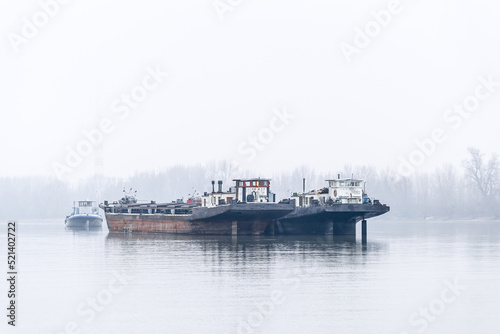 Anchored tankers during the winter period on the Danube River.