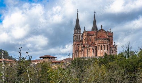 Basílica de Santa María la Real de Covadonga. Low point view of this great monumental temple built from 1877 to 1901, with a neo-Romanesque style and is made of pinkish marble stone extracted from the