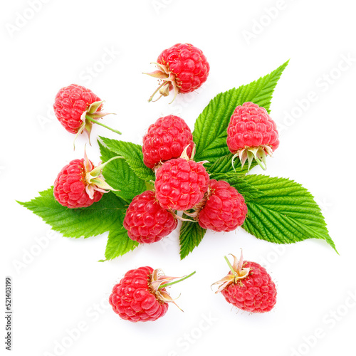 Flying pink berries with green leaves on a white background. Ripe summer raspberries.