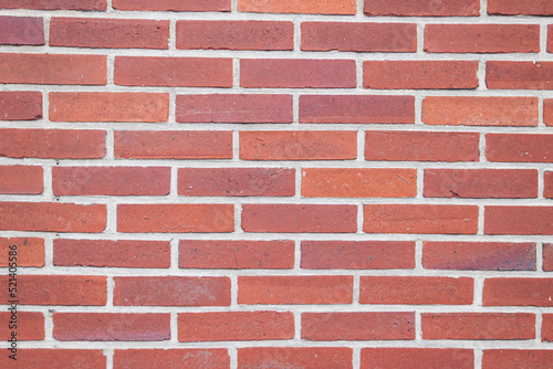 wall with red small bricks, background for a screensaver with a place for an inscription