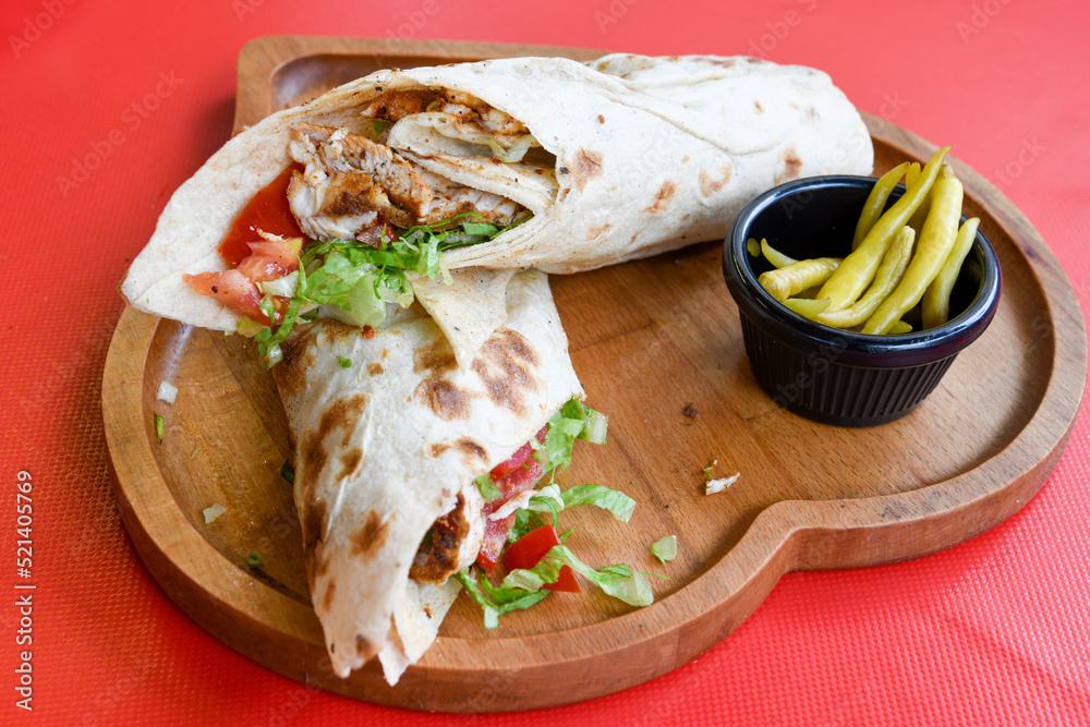 Lavash doner kebab ( doner zurna durum ) or shawarma sliced in plate