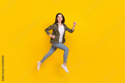 Fototapeta Naklejka Na Ścianę i Meble -  Full size profile side photo of overjoyed energetic shopaholic girl run shopping isolated on yellow color background