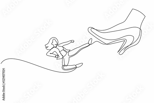 Single one line drawing young businesswoman kick giant foot stomp. Office worker doing flying kick to big high heels. Minimal metaphor concept. Continuous line draw design graphic vector illustration