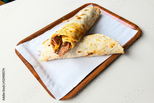 Lavash doner kebab ( doner zurna durum )  or shawarma sliced in plate isolated.  photo