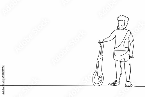 Single one line drawing primitive archaic man dressed in clothes made of animal skin and holding cudgel. Caveman from stone age. Neanderthal hunter. Continuous line graphic design vector illustration
