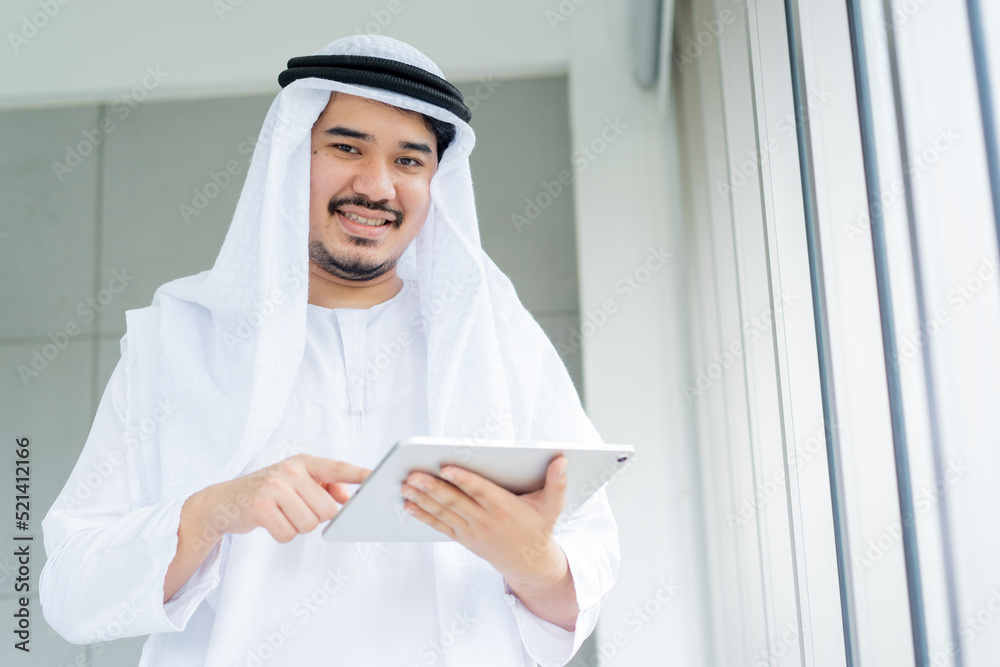 close up adult arab manager man use tablet for checking email or job form team in office for business and lifestyle concept