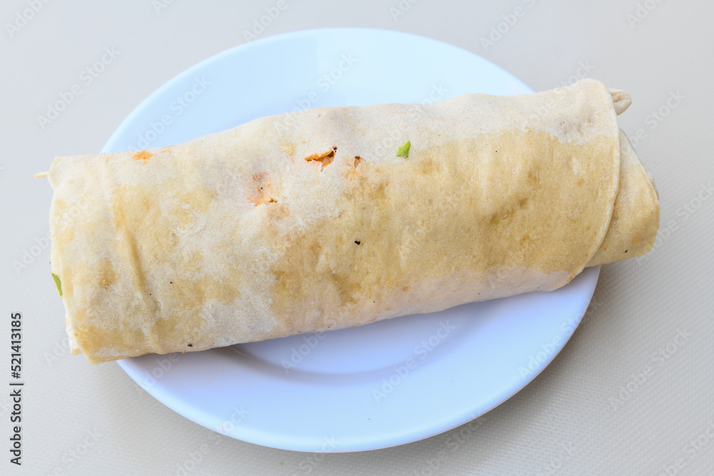 Lavash doner kebab ( doner zurna durum )  or shawarma sliced in plate isolated. 