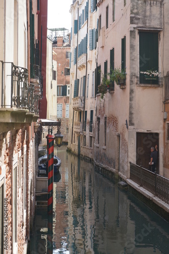 Gondolers in Venice Canals Italy Beautiful old architecture reflections high resolution  photo