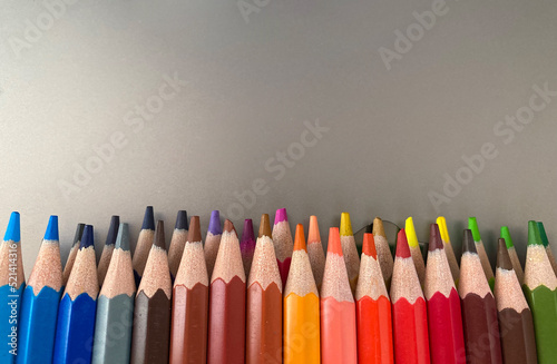 On a gray and metallic background, lay in two rows of colorful drawing pencils. The pencils are well sharpened. Good Drawing Kit