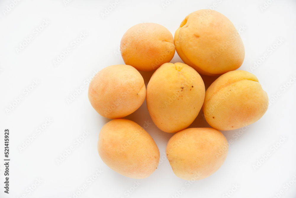 Yellow juicy fresh plum on a white background. Juicy yellow sweet fruits. Yellow juicy fresh plum on a white background. Juicy yellow sweet fruits.