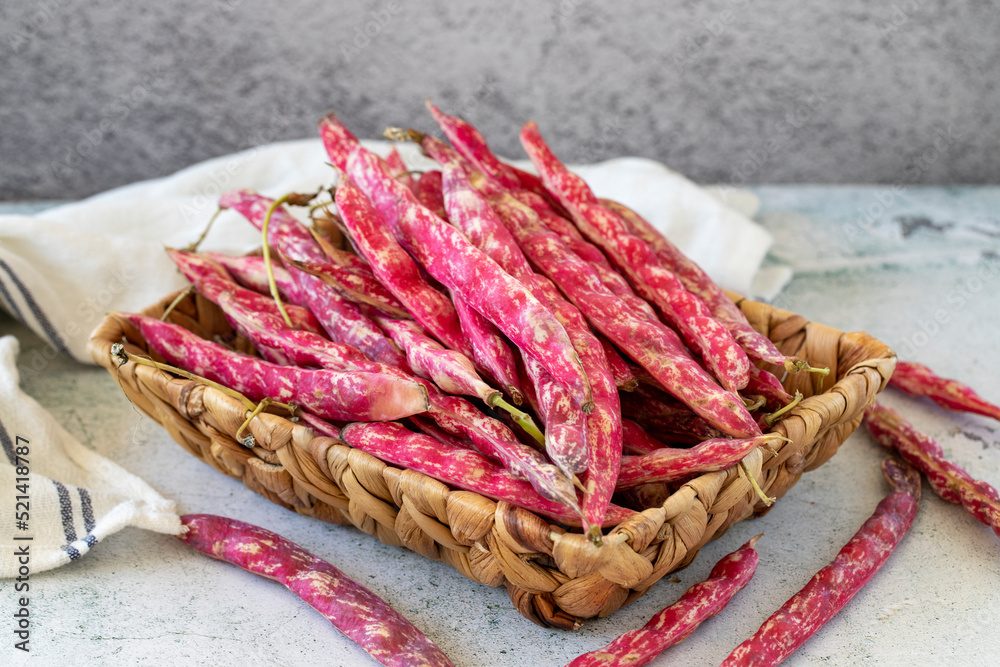 Ripe kidney beans. Fresh and raw kidney beans in basket on stone background. Organic food. close up Ripe kidney beans. Fresh and raw kidney beans in basket on stone background. Organic food. close up