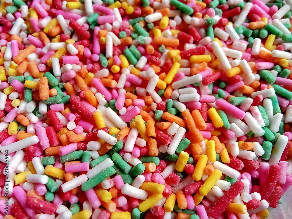 Colorful and chocolate candy sprinkles. Nonpareils, rainbow sprinkle