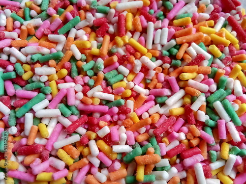 Colorful and chocolate candy sprinkles. Nonpareils, rainbow sprinkle