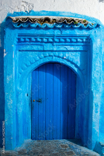 A blue door in the blue city Chefchaouen by night © Oualid