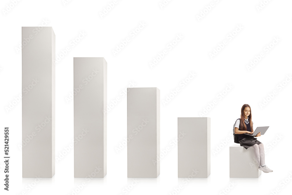 Schoolgirl sitting on a bar chart with a laptop computer Schoolgirl sitting on a bar chart with a laptop computer
