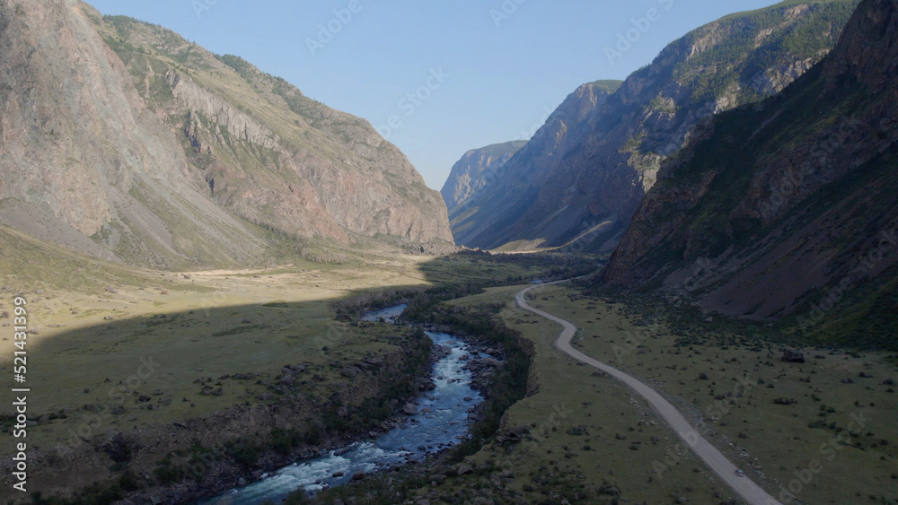 River Chulyshman between mountains with blue clear sky in Altai