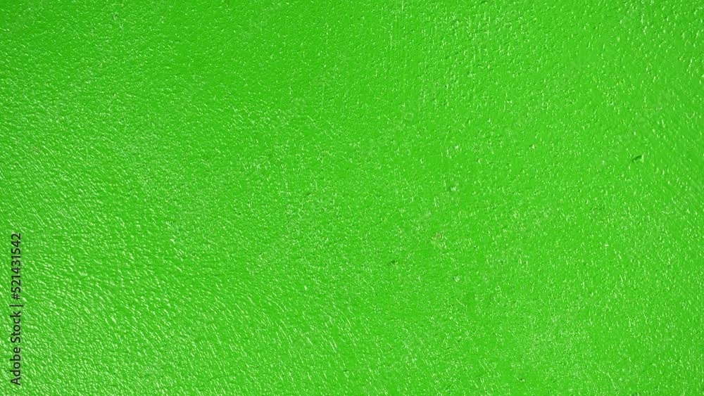 Slide shot of a painted wall surface. Macro dolly texture green surface as a moving background. Slide shot of a painted wall surface. Macro dolly texture green surface as a moving background.