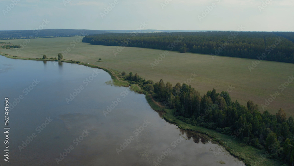 Lake and green fields in Ural Lake and green fields in Ural