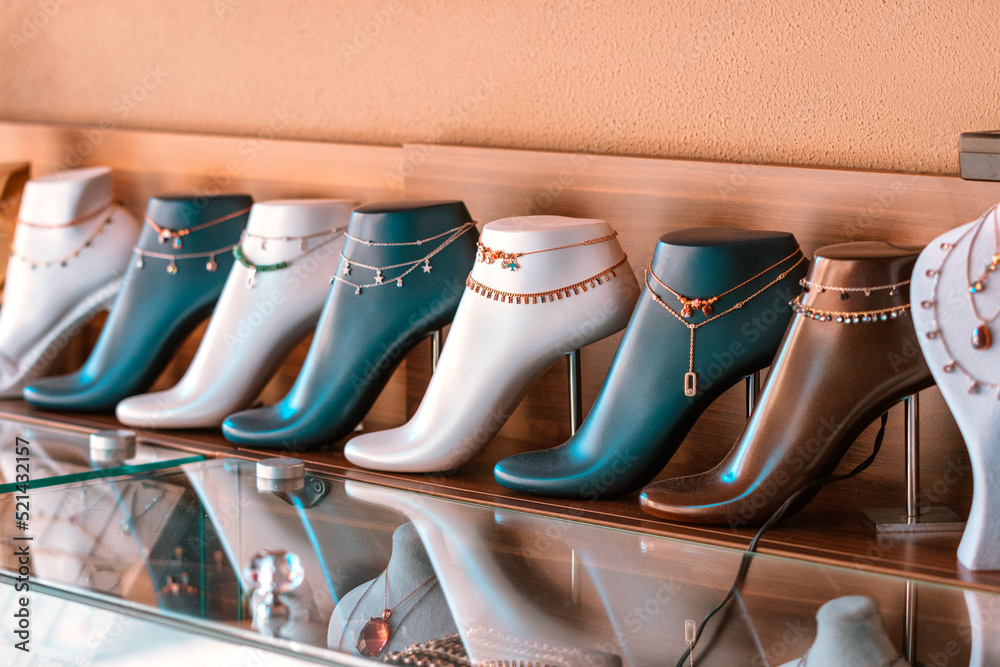 Ταπετσαρία anklet or ankle bracelet on a mannequin foot in a jewelry store window