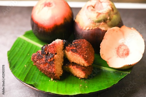 Thati rotte,south indian famous palm fruit plup cake closeup with selective focus and blur photo