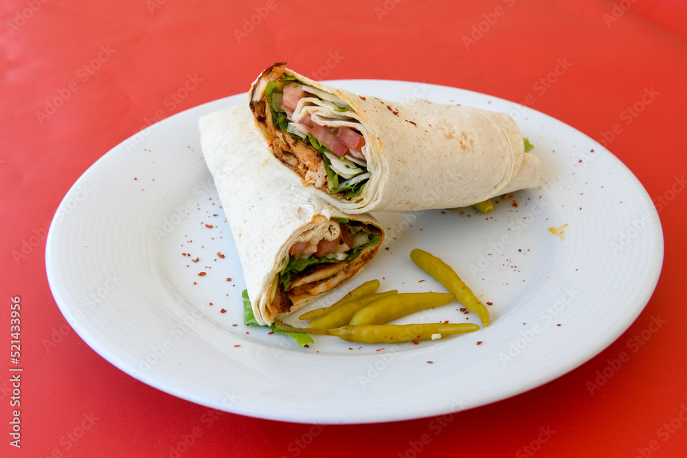 Lavash doner kebab ( doner zurna durum )  or shawarma sliced in plate isolated. 