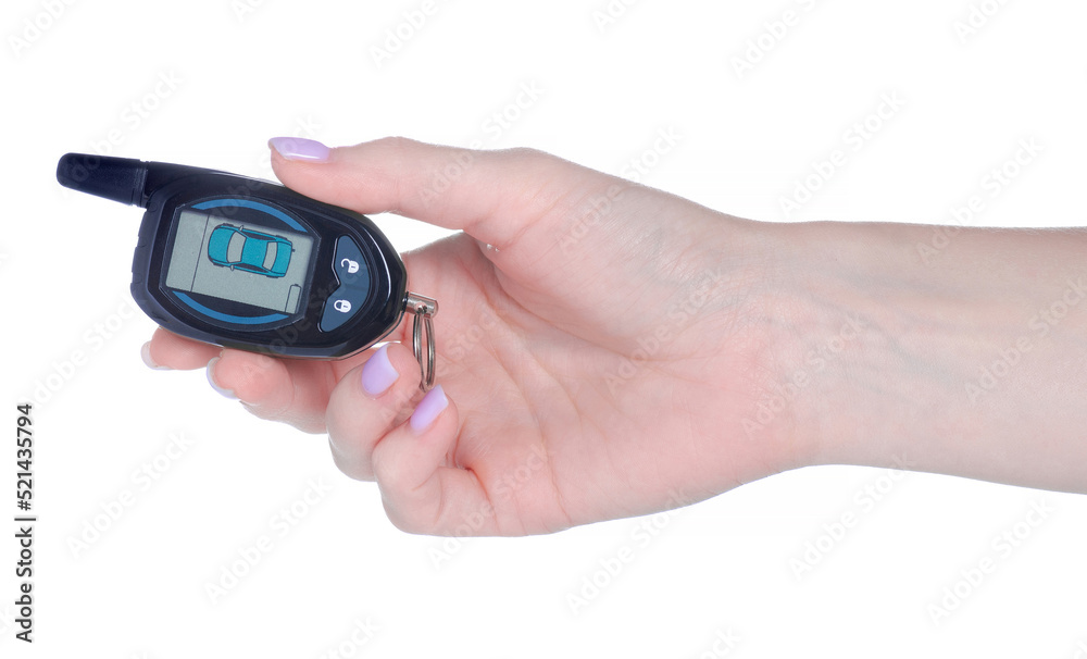 Key fob car alarm in hand on white background isolation Key fob car alarm in hand on white background isolation