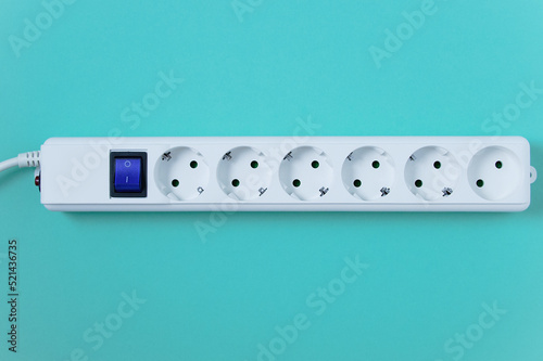 White electrical surge protector with a six sockets.