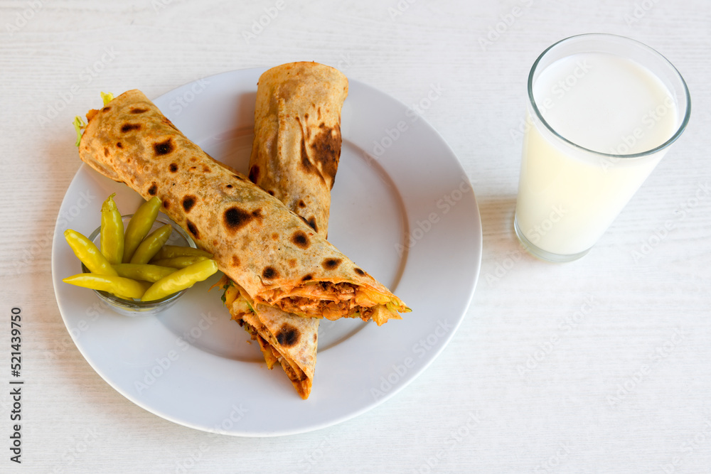 Lavash doner kebab ( doner zurna durum ) or shawarma sliced in plate