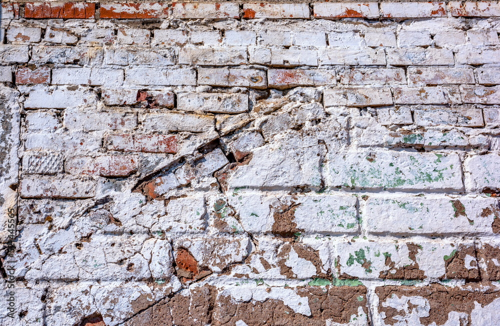 old brick painted wall with cracks old brick painted wall with cracks
