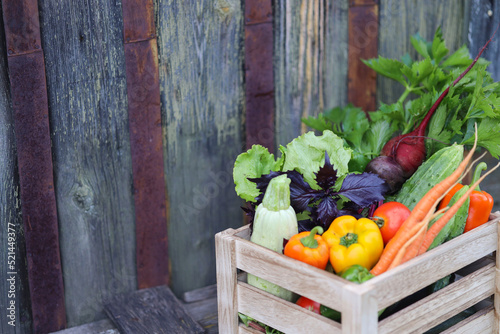 Fresh vegetables in wooden box on wooden background. preserving vegetables
