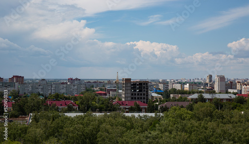 View of the buildings from the Ferris wheel in the park named after the 30th anniversary of the Komsomol of Omsk in summer