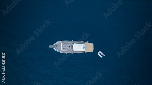 aerial top view of a boat in blue water