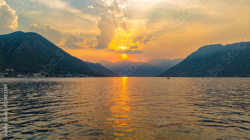 aerial view on bay over the water during sunset with mountains on backgorund