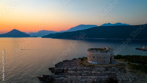 fort arza on cape during sunset with mountains on background photo