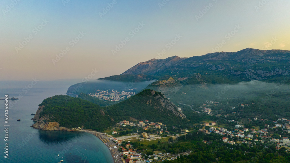 aerial view on Petrovac, Budva with clouds on sunrise