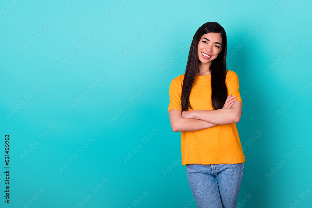 Photo of joyful brunette long hairdo lady crossed hands near promo wear yellow t-shirt jeans isolated on teal color background Photo of joyful brunette long hairdo lady crossed hands near promo wear yellow t-shirt jeans isolated on teal color background