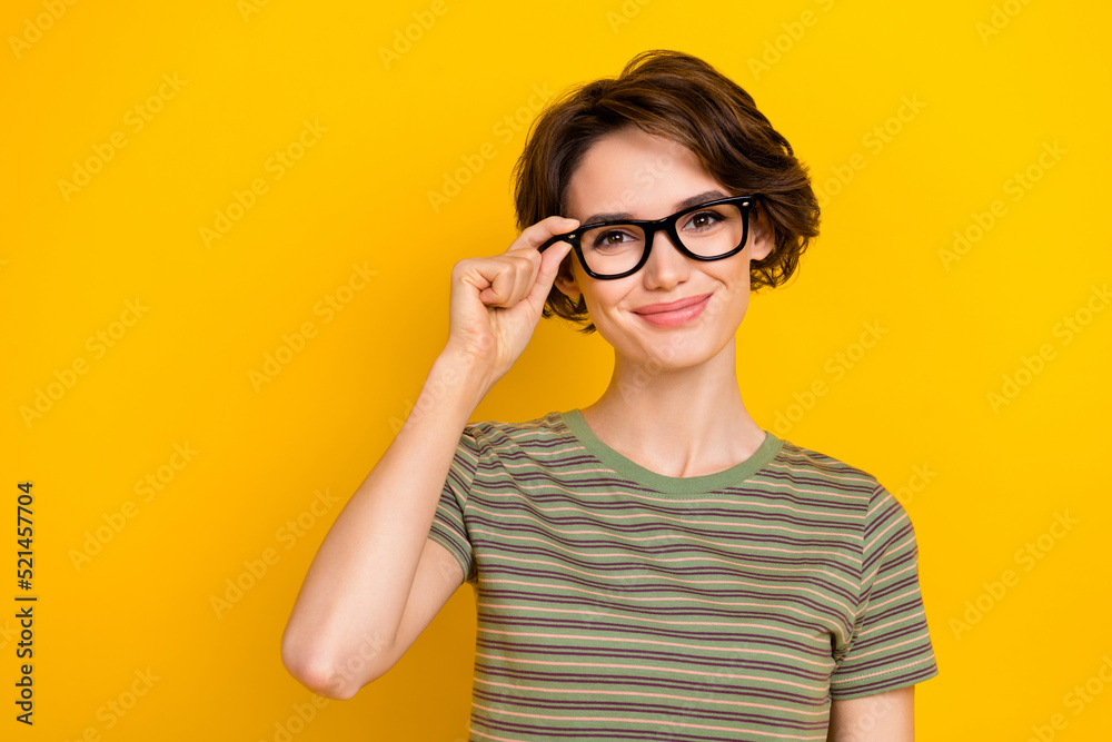 Photo of sweet adorable lady wear striped t-shirt arm spectacles smiling empty space isolated yellow color background