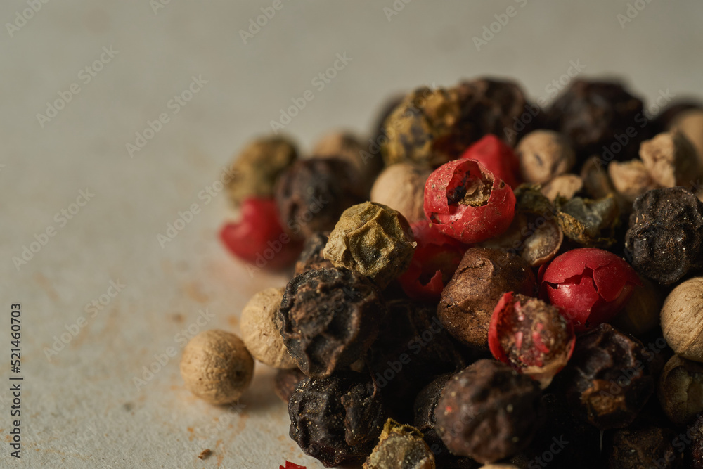 Details of a mountain of colored pepper on a white background Details of a mountain of colored pepper on a white background