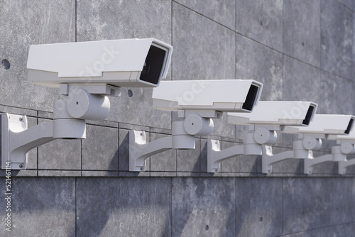 Security cameras on the concrete wall.
Outdoor Security cameras. CCTV, secure, monitoring concept. 3d rendering