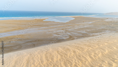 Valokuva qatar adventurous place khor al udeid ,sea line beach during sunset
