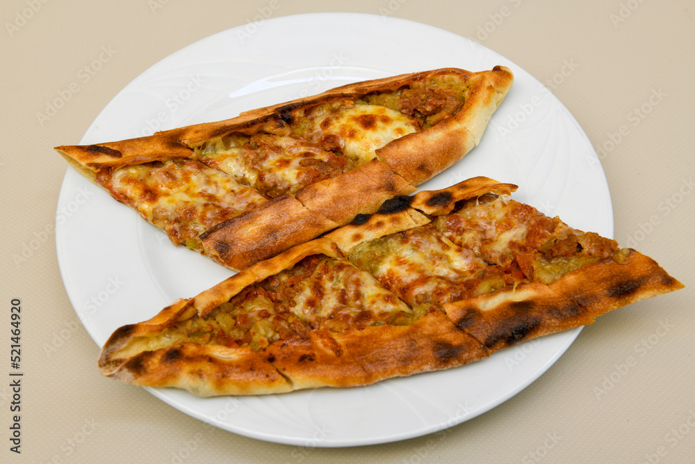 Turkish pita with minced cubed meat and cheese (Turkish name: Kiyma Kusbasi kasarli pide) Turkish pita with minced cubed meat and cheese (Turkish name: Kiyma Kusbasi kasarli pide)