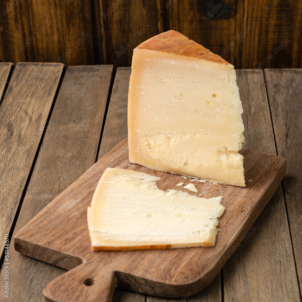 Artisanal Tulha cheese from Brazil over wooden table