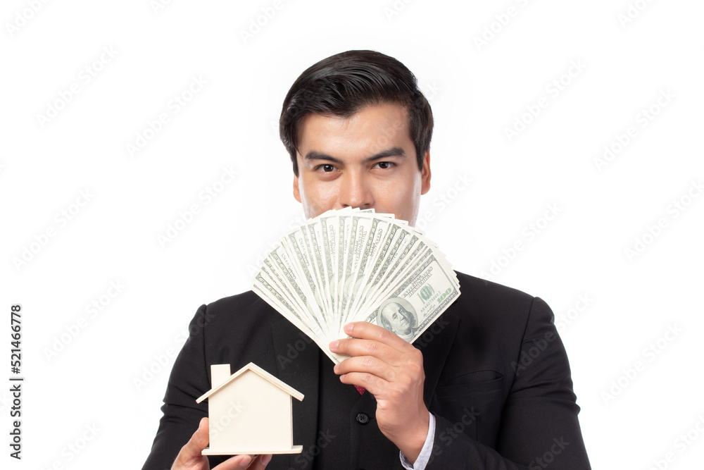 Image of handsome businessmam holding house model in hands. Mortgage, loan, rent, real estate purchase isolated on white background. Image of handsome businessmam holding house model in hands. Mortgage, loan, rent, real estate purchase isolated on white background.