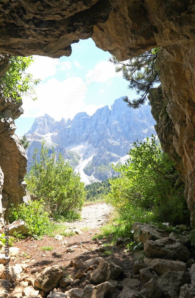 view of the Dolomites mountains photographed from inside a cave dug by soldiers during the First World War