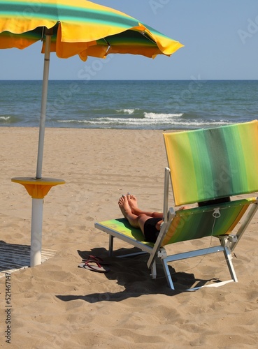 deck chairs to relax under the umbrella on the beach