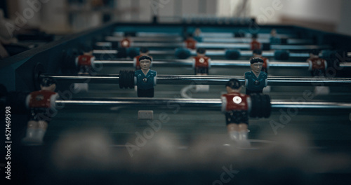 Wallpaper Mural Closeup miniature plastic figures on football table. Children hands revolve rods Torontodigital.ca