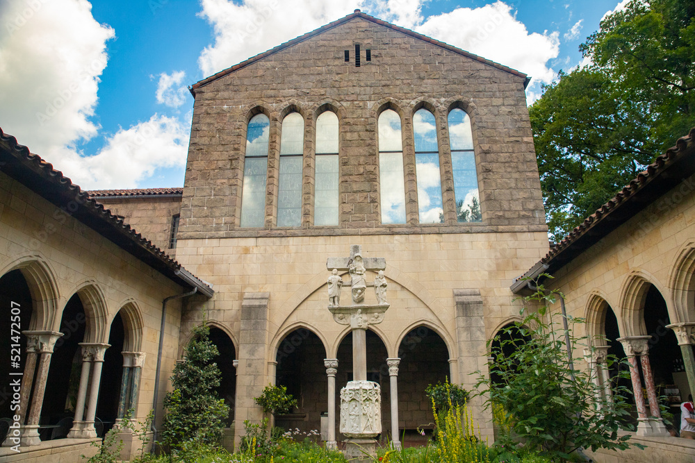 Exterior View of the Met Cloisters in Washington Height Manhattan with architectural details and garden Exterior View of the Met Cloisters in Washington Height Manhattan with architectural details and garden