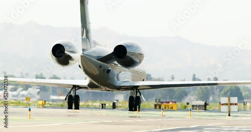 Panning A Rear View Of A Luxury Gulfstream Private Jet As It Turns At Van Nuys Airport - Los Angeles, California